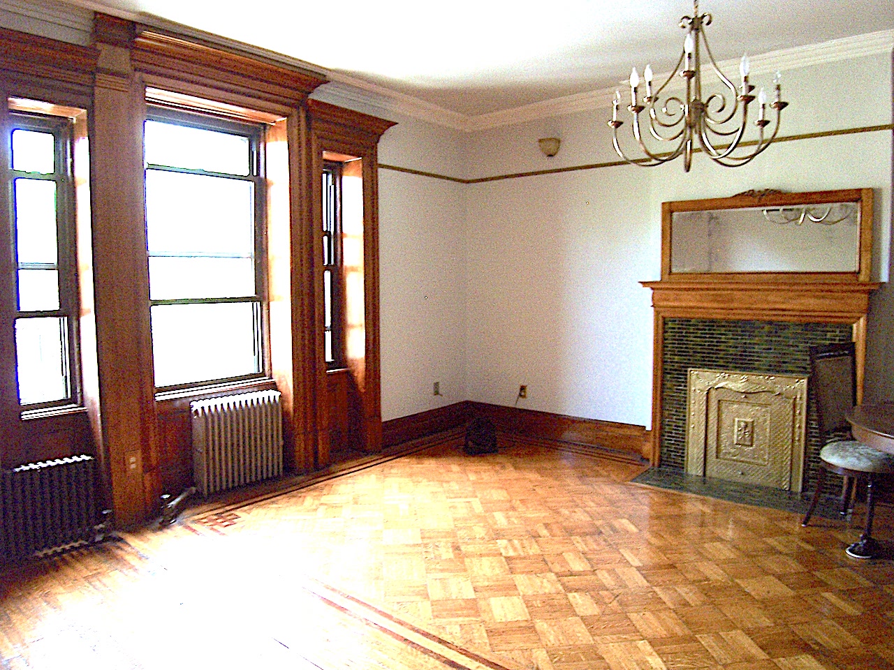 864 Prospect Place, Unit 2 Brooklyn, NY 11216 - Photo 1 of 6 a view of an empty room with a fireplace and a window