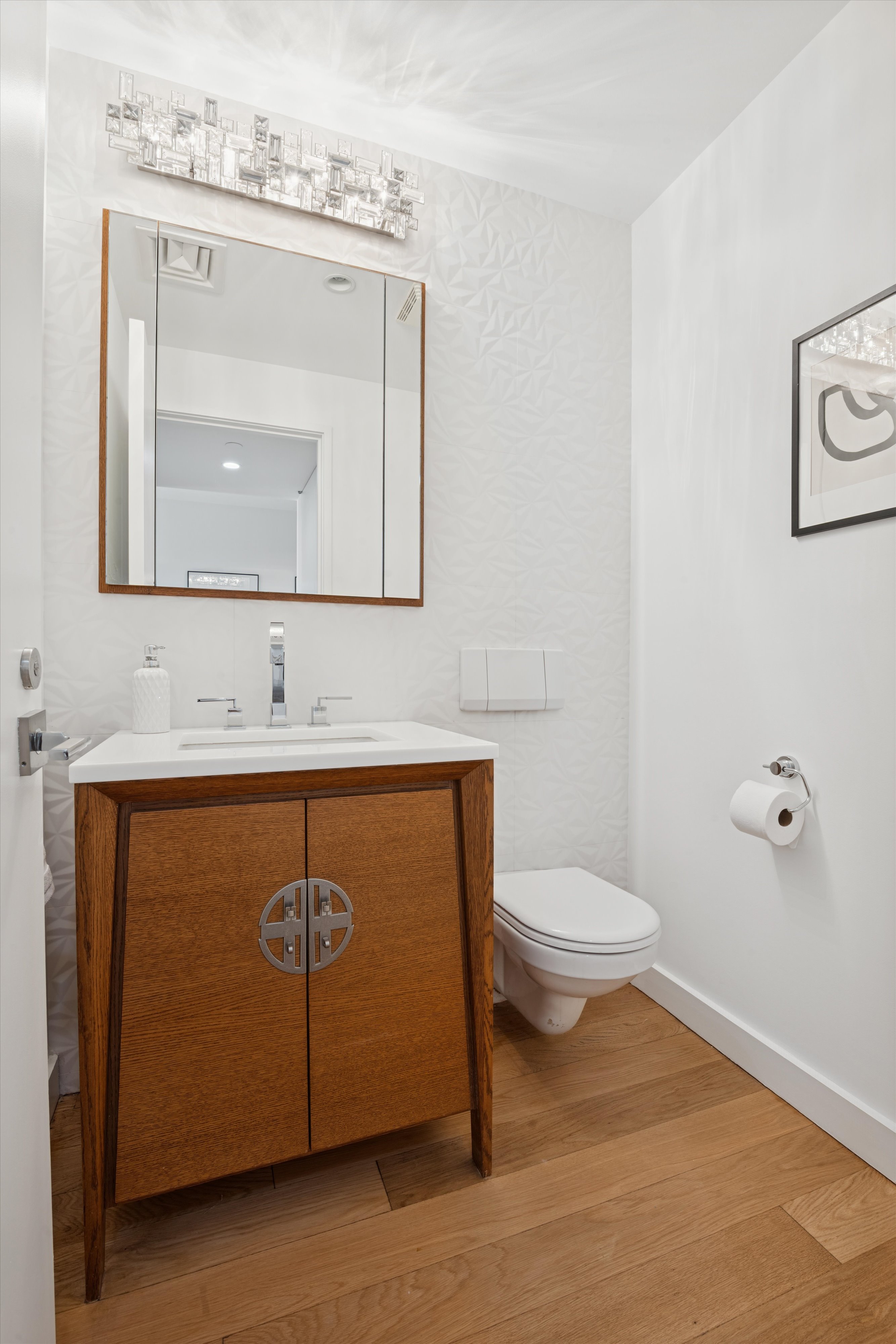 109 West 26th Street, Unit 9 Manhattan, NY 10001 - Photo 18 of 23 a bathroom with a toilet sink and mirror