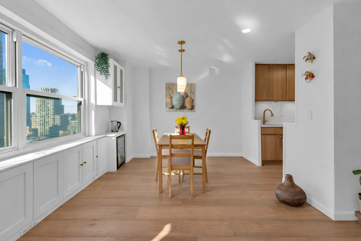 a dining room with furniture a rug a fireplace and windows