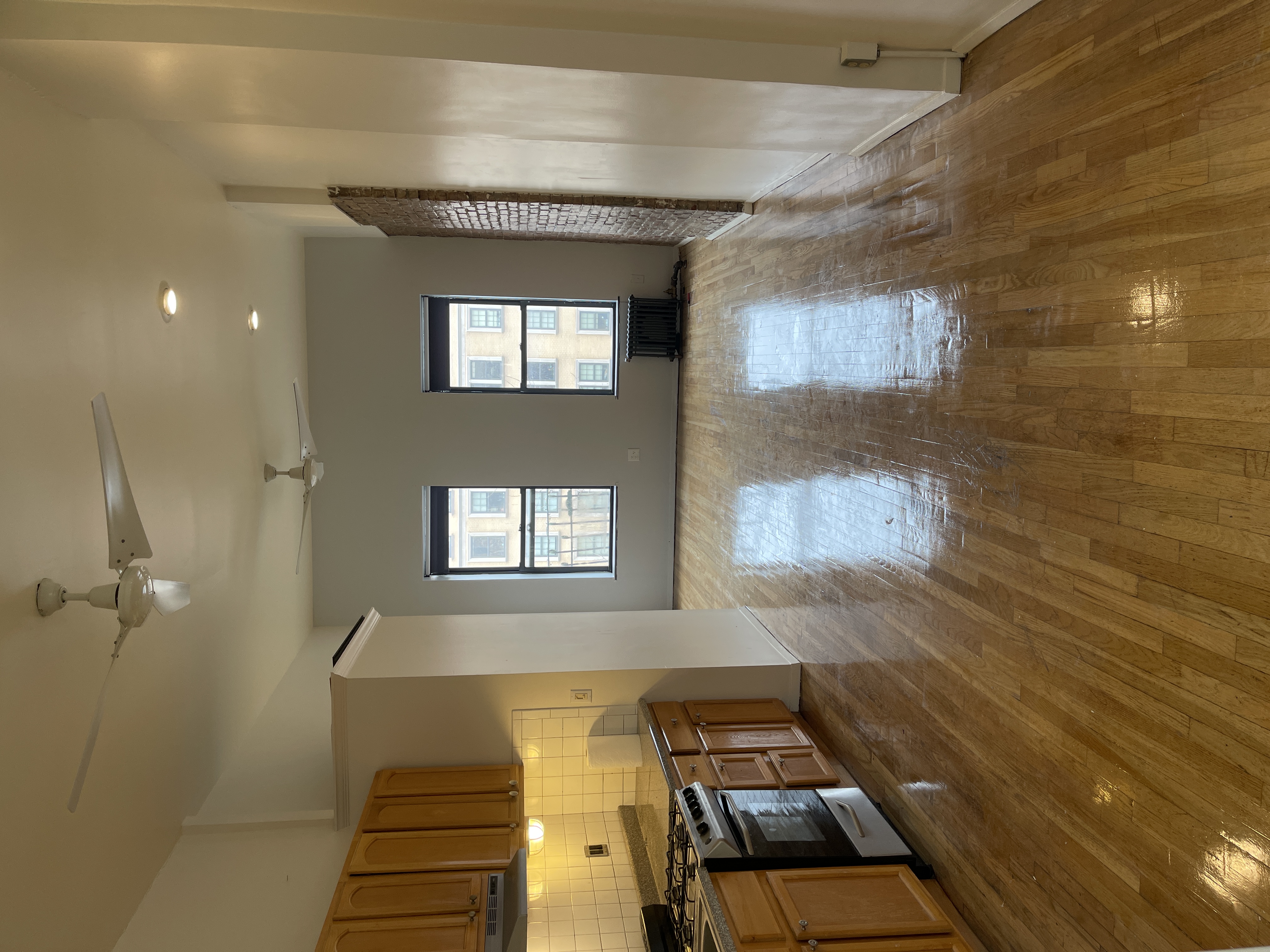 1672 Park Avenue Manhattan, NY 10035 - Photo 7 of 35 an empty room with wooden floor and windows