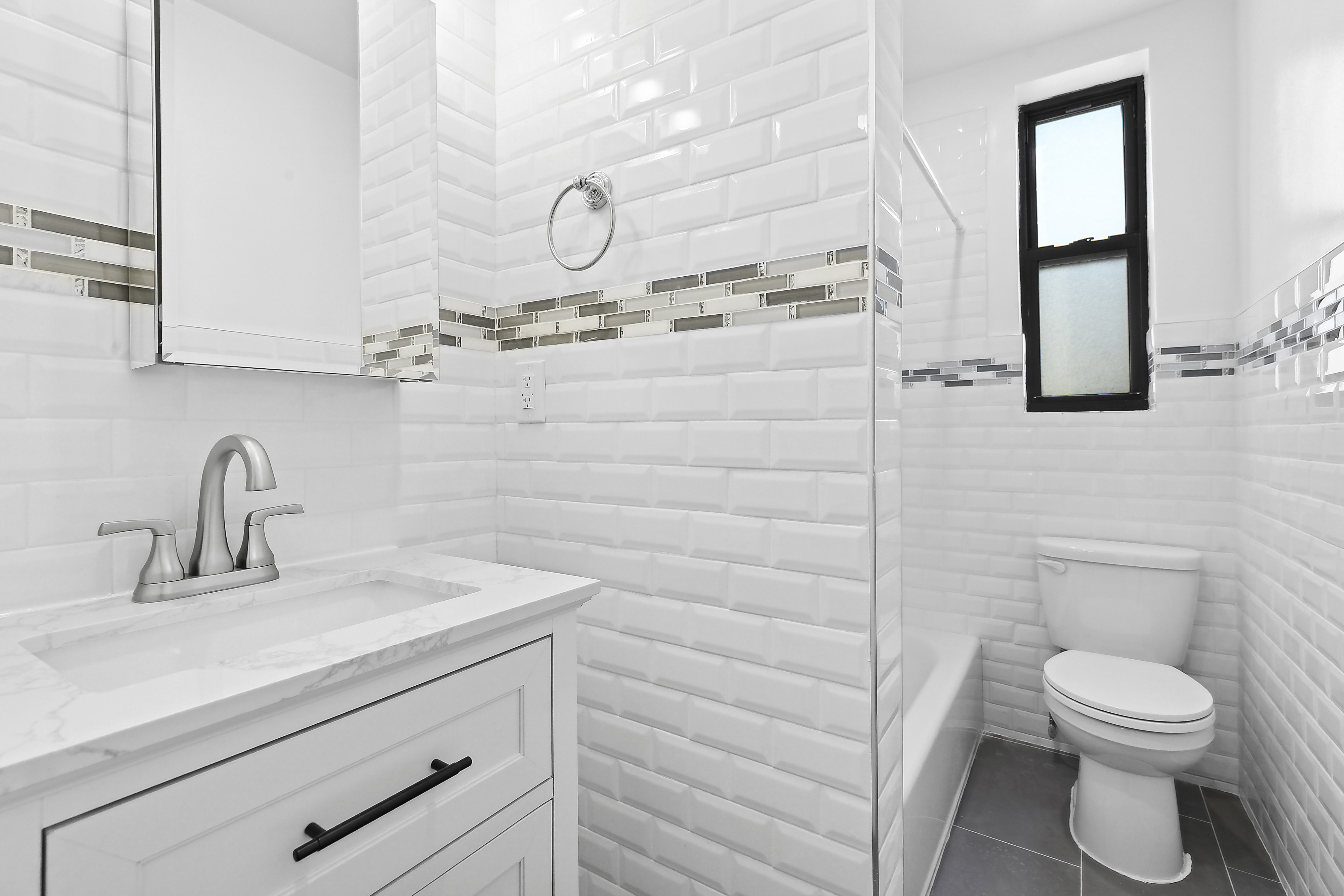 159-34 Riverside Drive West, Unit 5F90 Manhattan, NY 10032 - Photo 9 of 23 a bathroom with a sink a toilet and mirror