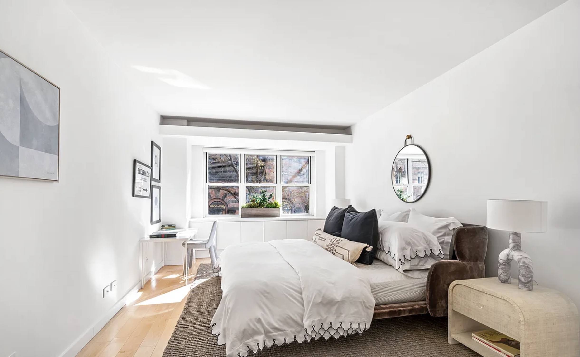 130 East 63rd Street, Unit 3D Manhattan, NY 10065 - Photo 5 of 13 a bedroom with bed and a large window