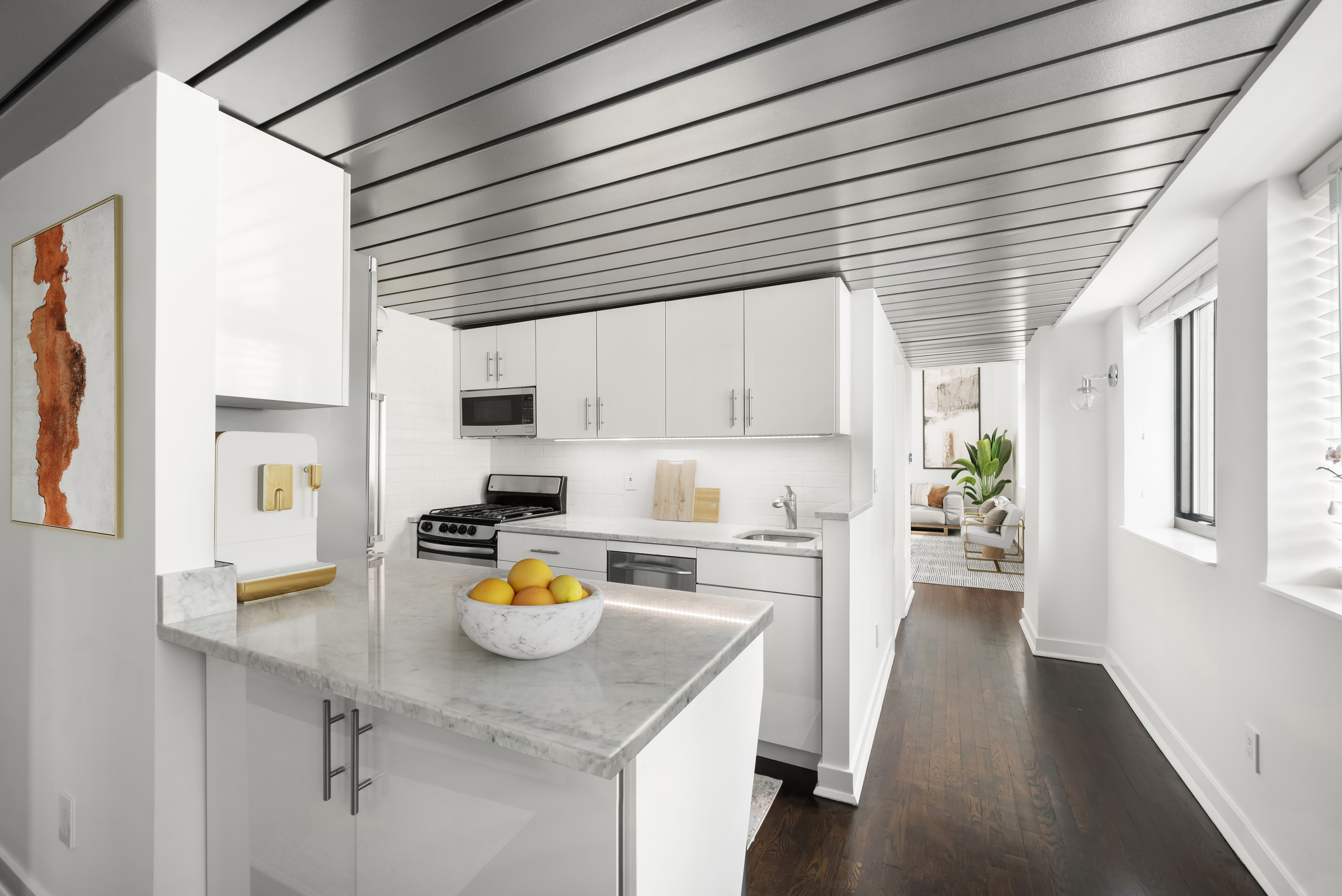 421 Hudson Street, Unit 325 Manhattan, NY 10014 - Photo 7 of 11 a kitchen with a sink appliances cabinets and dining table