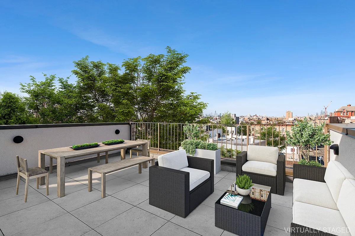 496 Wilson Avenue, Unit 4A Brooklyn, NY 11221 - Photo 3 of 10 a view of a roof deck with couches and potted plants