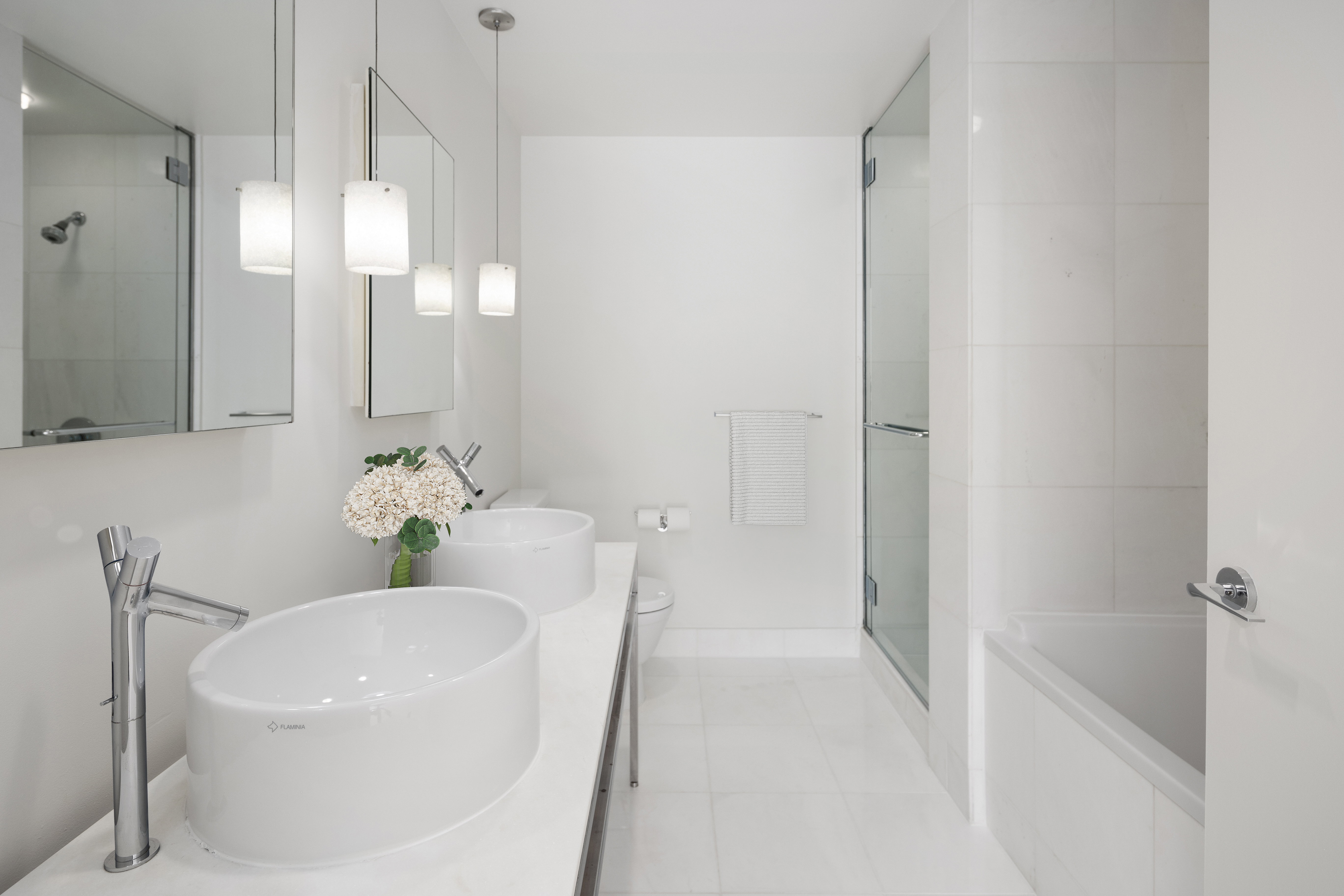 15 Broad Street, Unit 2926 Manhattan, NY 10005 - Photo 8 of 26 a bathroom with a sink a toilet and bathtub