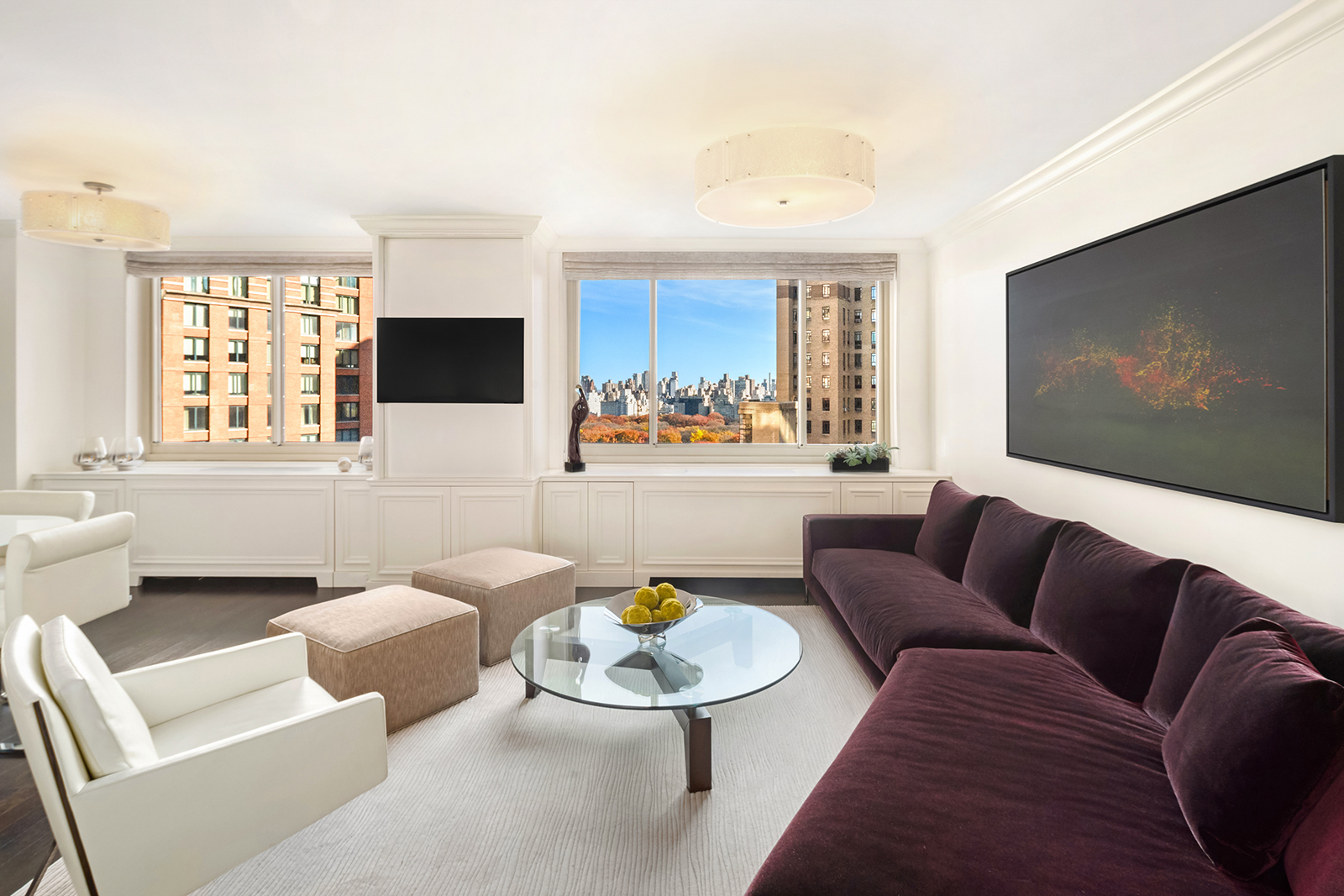 30 West 63rd Street, Unit 26VW Manhattan, NY 10023 - Photo 3 of 20 a living room with furniture and a flat screen tv