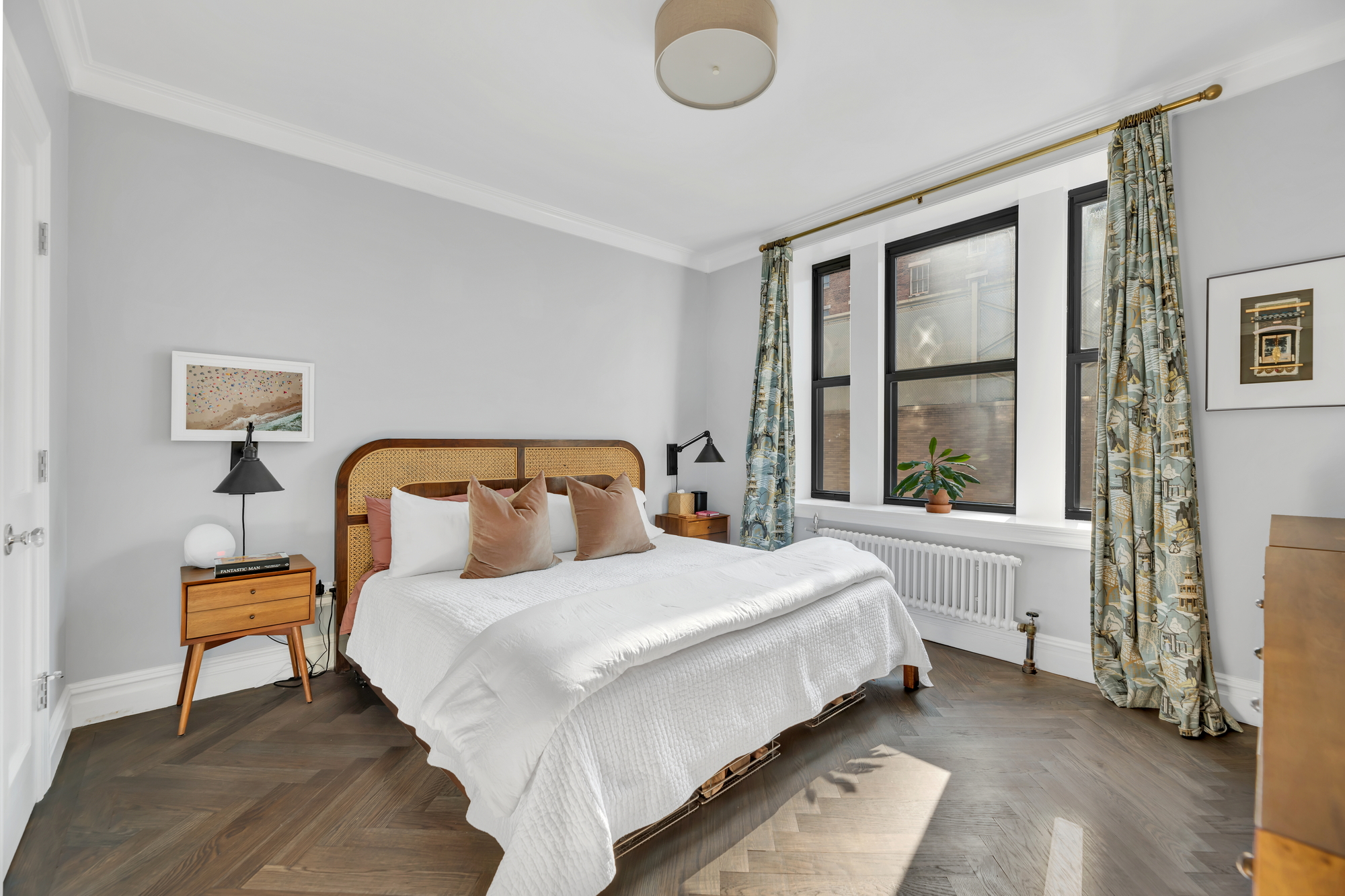 420 Riverside Drive, Unit 2G Manhattan, NY 10025 - Photo 8 of 20 a bedroom with a bed and a large window