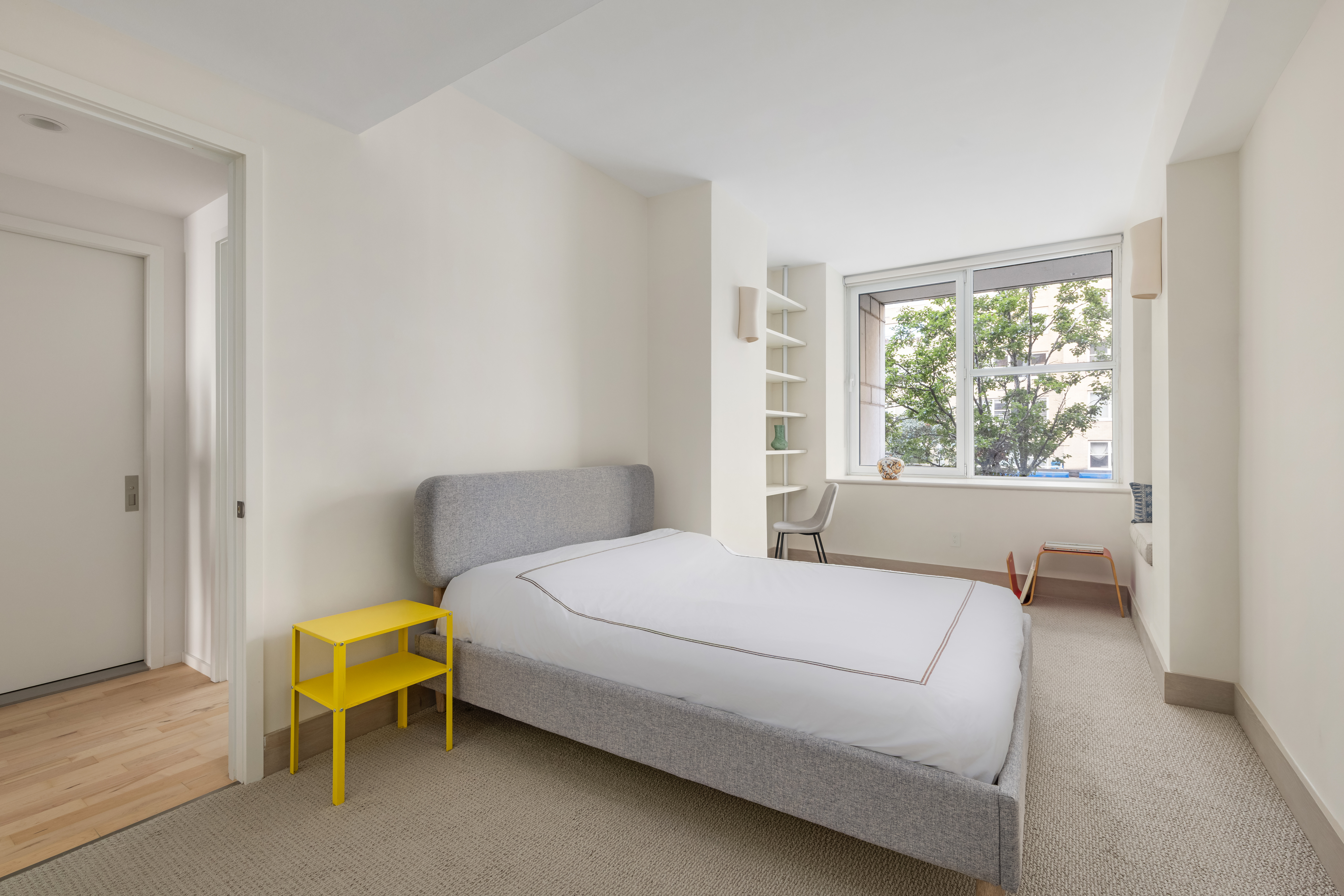 404 East 76th Street, Unit 2B Manhattan, NY 10021 - Photo 14 of 24 a bedroom with a bed and a window