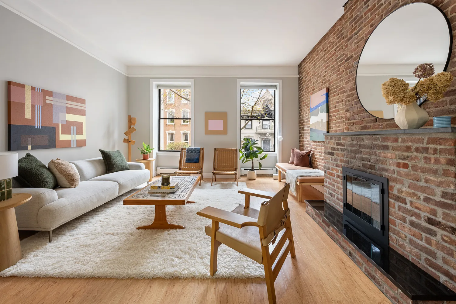 a living room with fireplace furniture and a fireplace