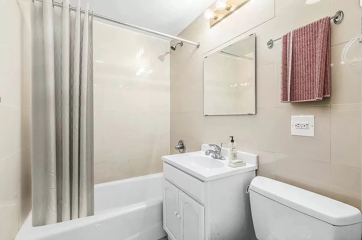 371 West 126th Street, Unit 5B Manhattan, NY 10027 - Photo 4 of 6 a bathroom with a sink toilet and shower