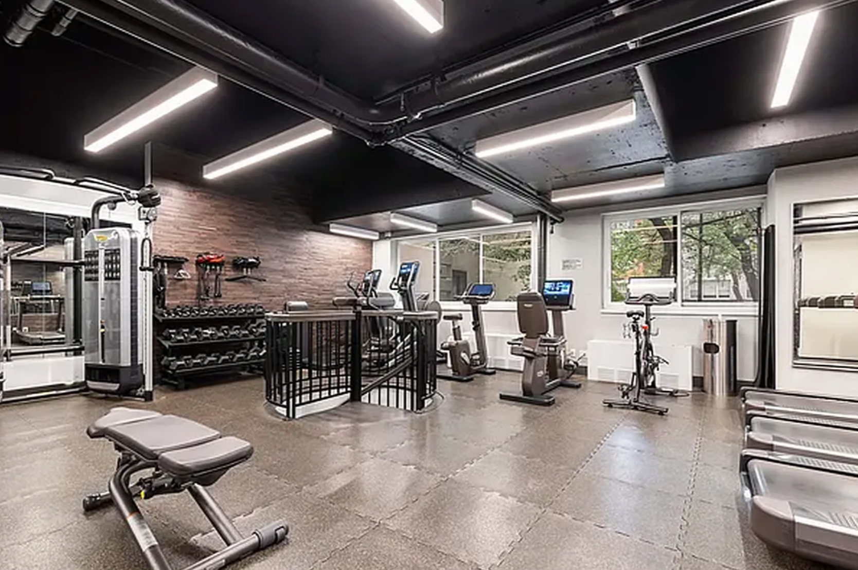 167 East 61st Street, Unit 23D Manhattan, NY 10065 - Photo 10 of 13 a view of a room with gym equipment