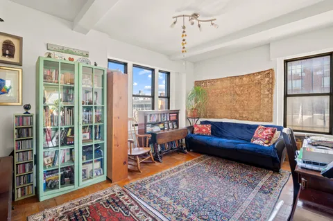 a living room with furniture and a rug