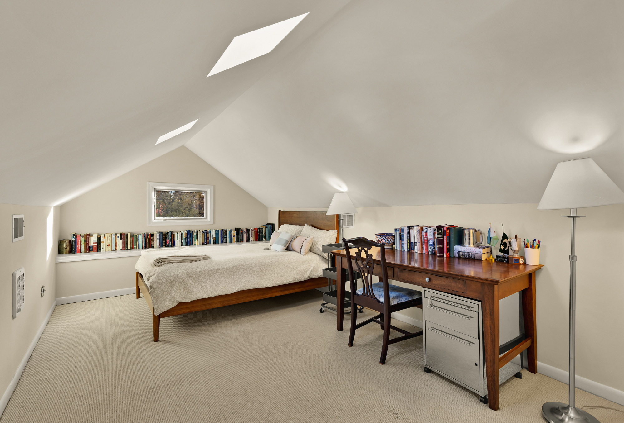 6815 Delaware Street Chevy Chase, MD 20815 - Photo 21 of 34 a bedroom with furniture and a book shelf