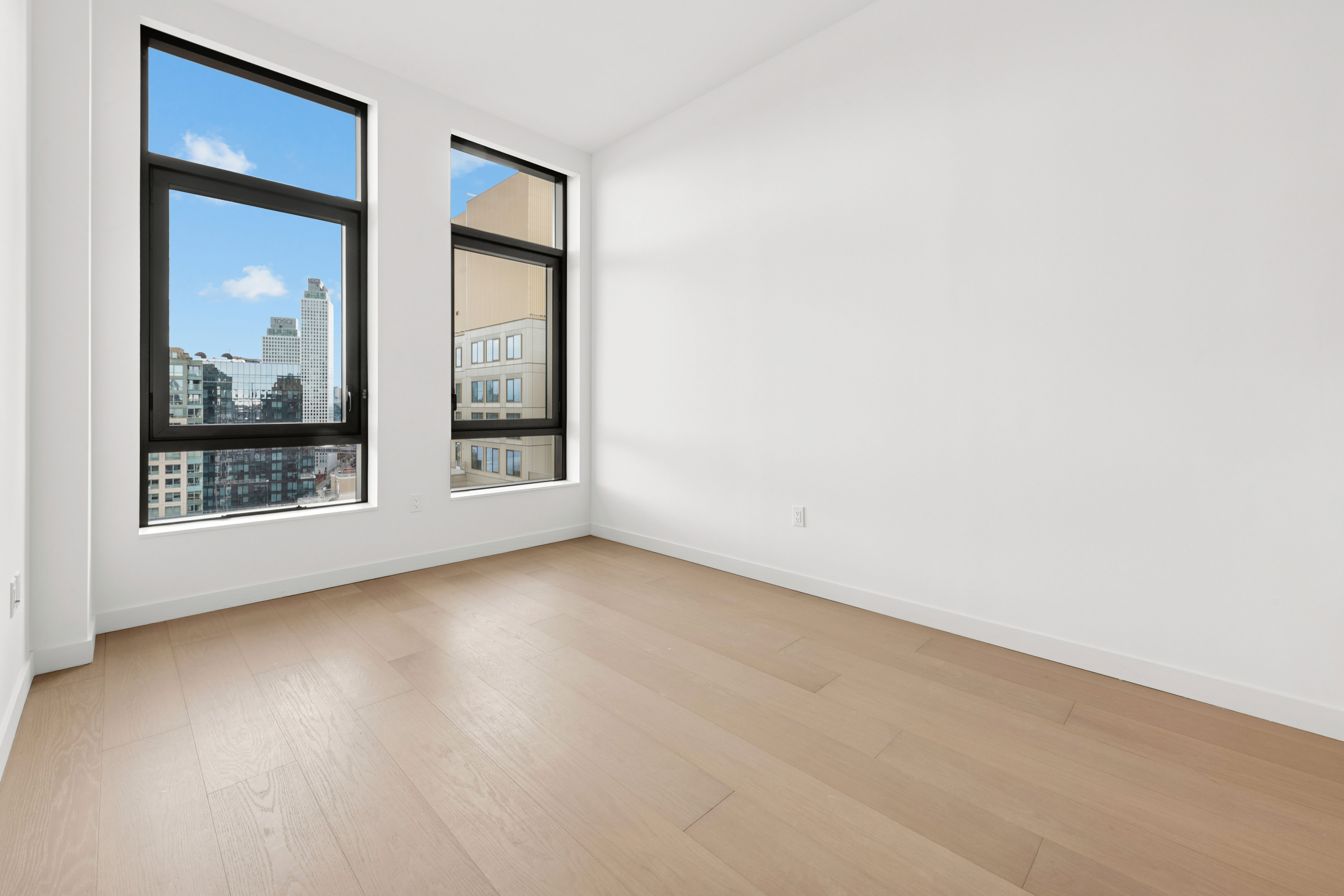 480 Kent Avenue, Unit 21C Brooklyn, NY 11249 - Photo 2 of 23 an empty room with window