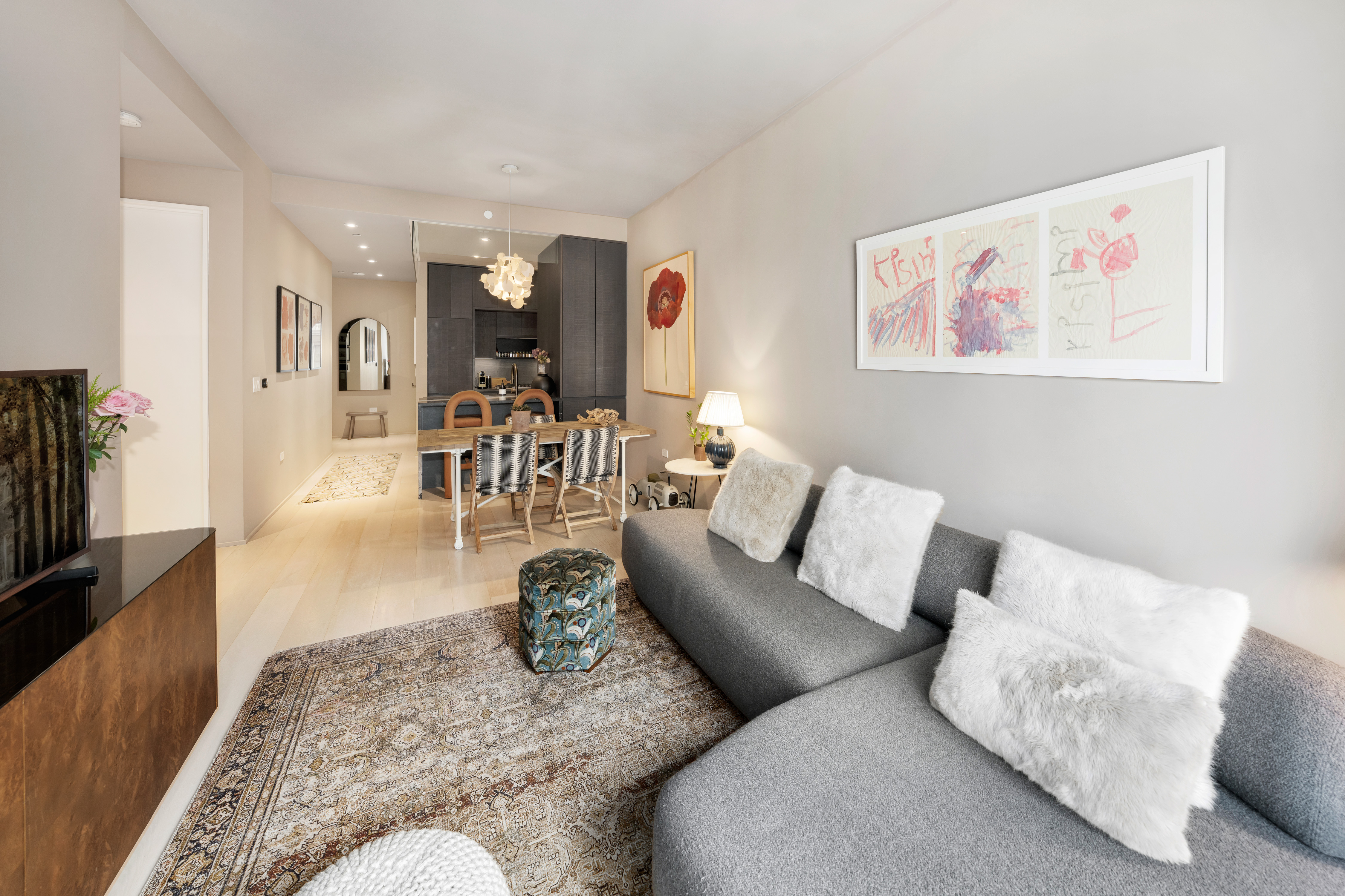 130 William Street, Unit 21A Manhattan, NY 10038 - Photo 4 of 13 a living room with furniture and wooden floor