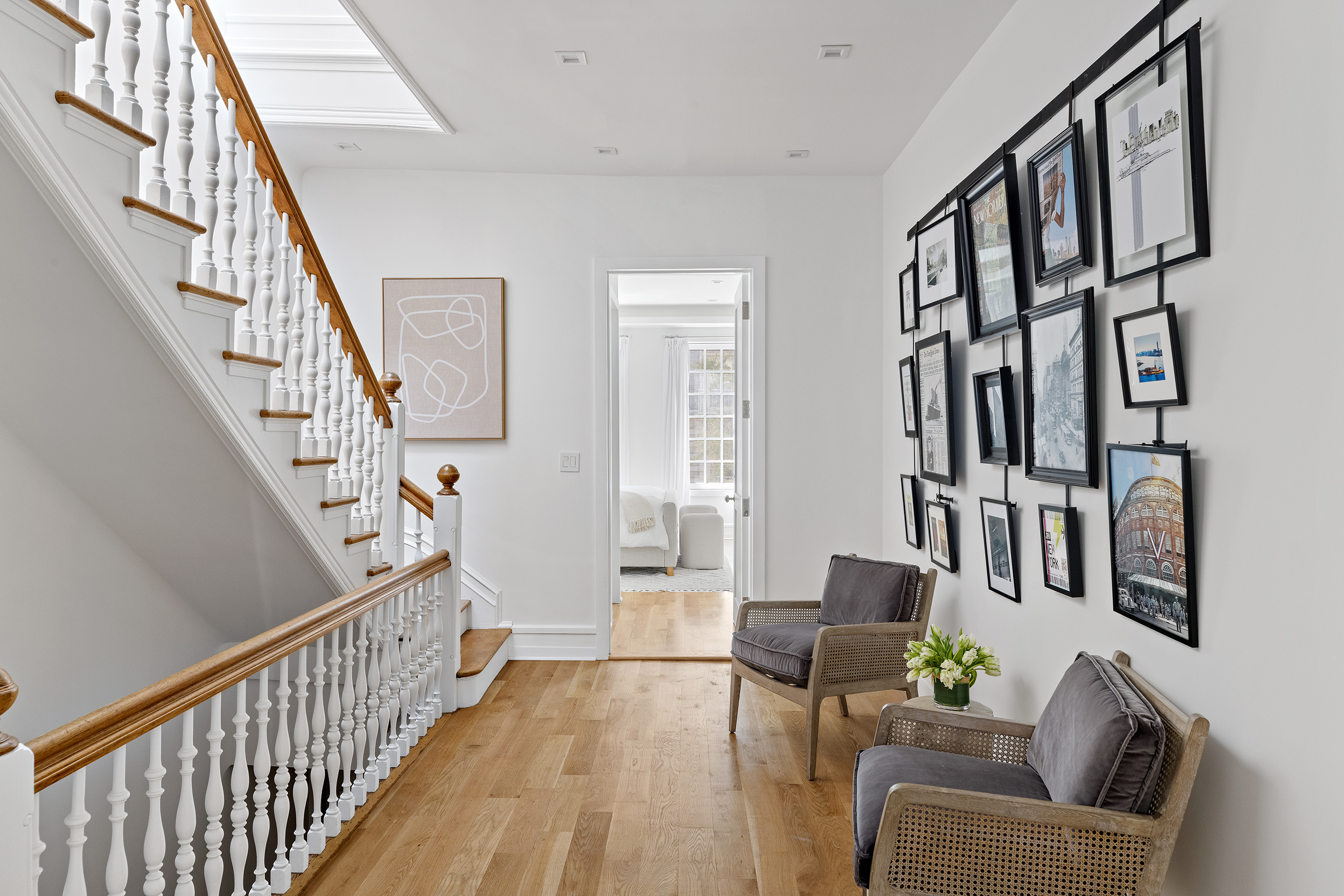 25 East 94th Street Manhattan, NY 10128 - Photo 23 of 33 a living room with furniture and stairs