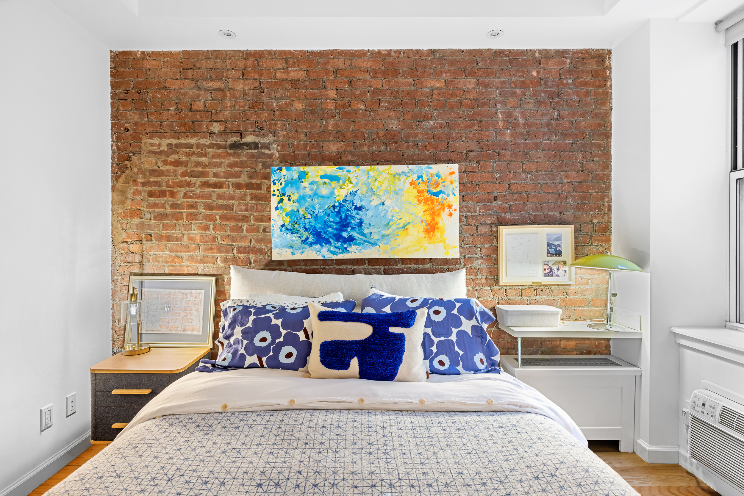 23 East 10th Street, Unit 231 Manhattan, NY 10003 - Photo 7 of 9 a bedroom with a bed and balcony view