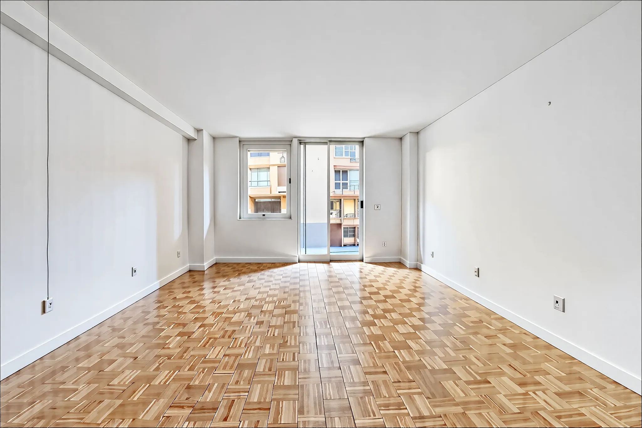 350 West 50th Street, Unit 2DD Manhattan, NY 10019 - Photo 3 of 7 a view of empty room with window