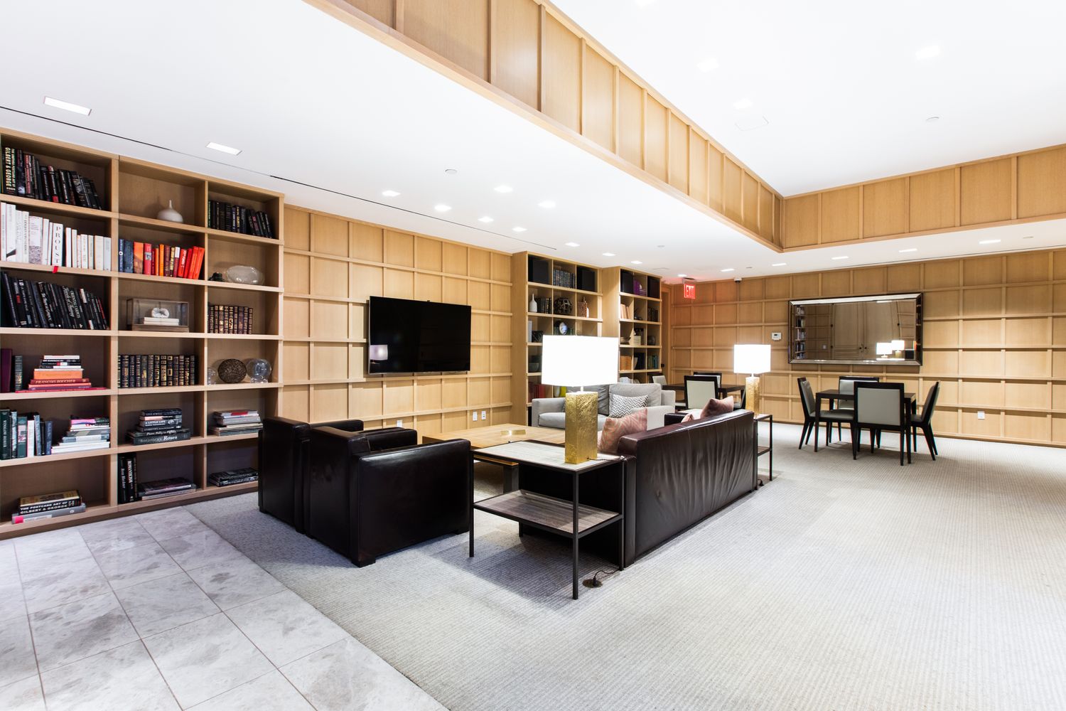 170 East End Avenue, Unit 16B Manhattan, NY 10128 - Photo 19 of 21 a living room with furniture a flat screen tv and view of kitchen