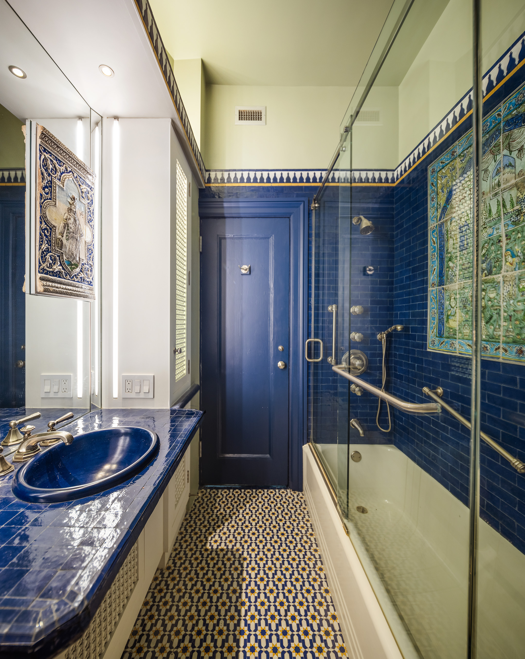 45 East 66th Street, Unit 4NW Manhattan, NY 10065 - Photo 20 of 29 a bathroom with a tub a sink and large mirror