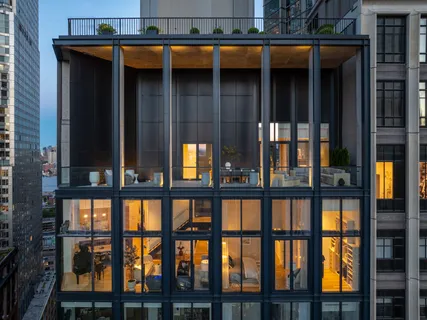 a front view of a house with glass windows