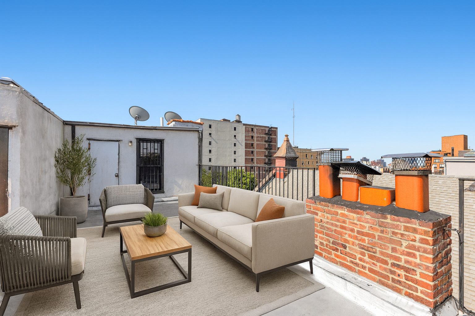 521 Dean Street, Unit 4L Brooklyn, NY 11217 - Photo 5 of 17 a roof deck with couches and potted plants with sky view
