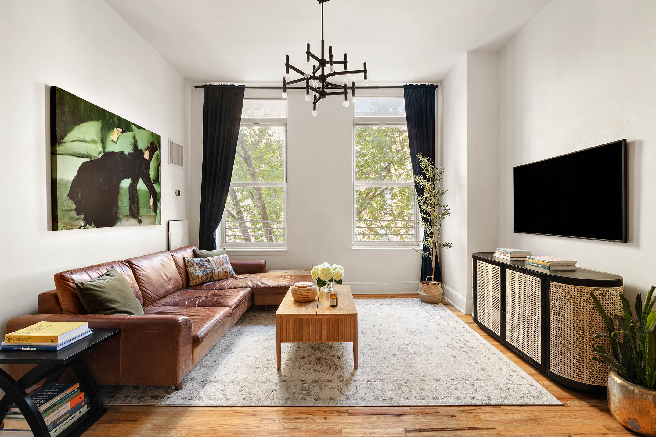 a living room with furniture and a flat screen tv