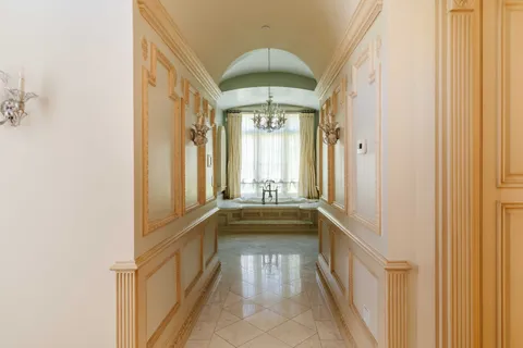 a bathroom with a tub sink and mirror