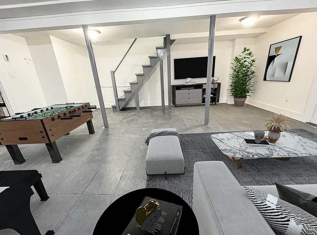 1128 Bushwick Avenue, Unit A Brooklyn, NY 11221 - Photo 3 of 14 a living room with furniture and a flat screen tv