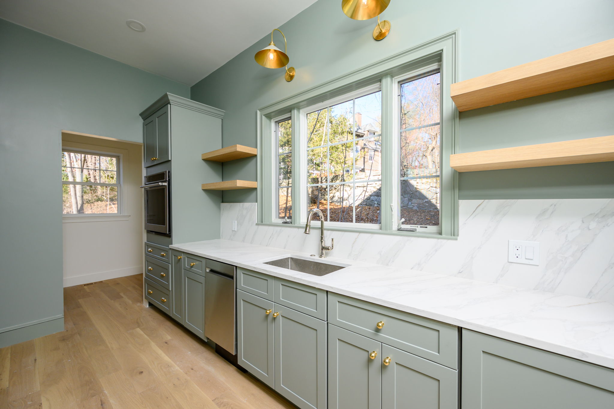 249 Central Avenue Milton, MA 02186 - Photo 16 of 61 a kitchen with stainless steel appliances a sink stove and window