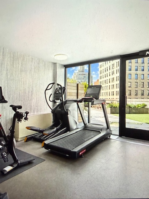 40 East 94th Street, Unit 6F Manhattan, NY 10128 - Photo 12 of 17 a view of a room with gym equipment