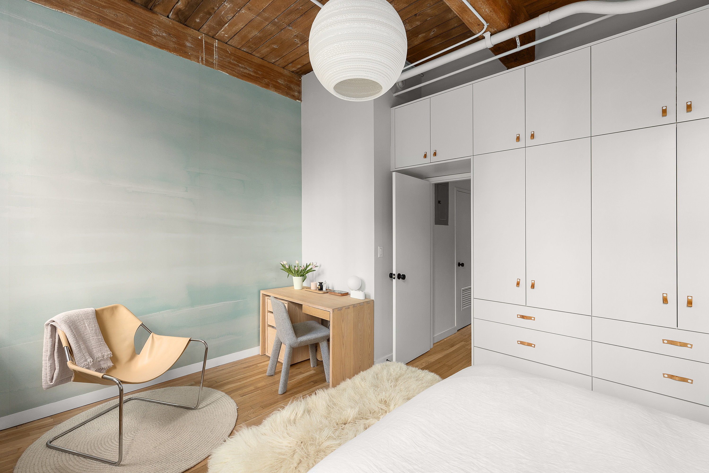 420 12th Street, Unit E1L Brooklyn, NY 11215 - Photo 9 of 15 a bedroom with a bed and cabinets