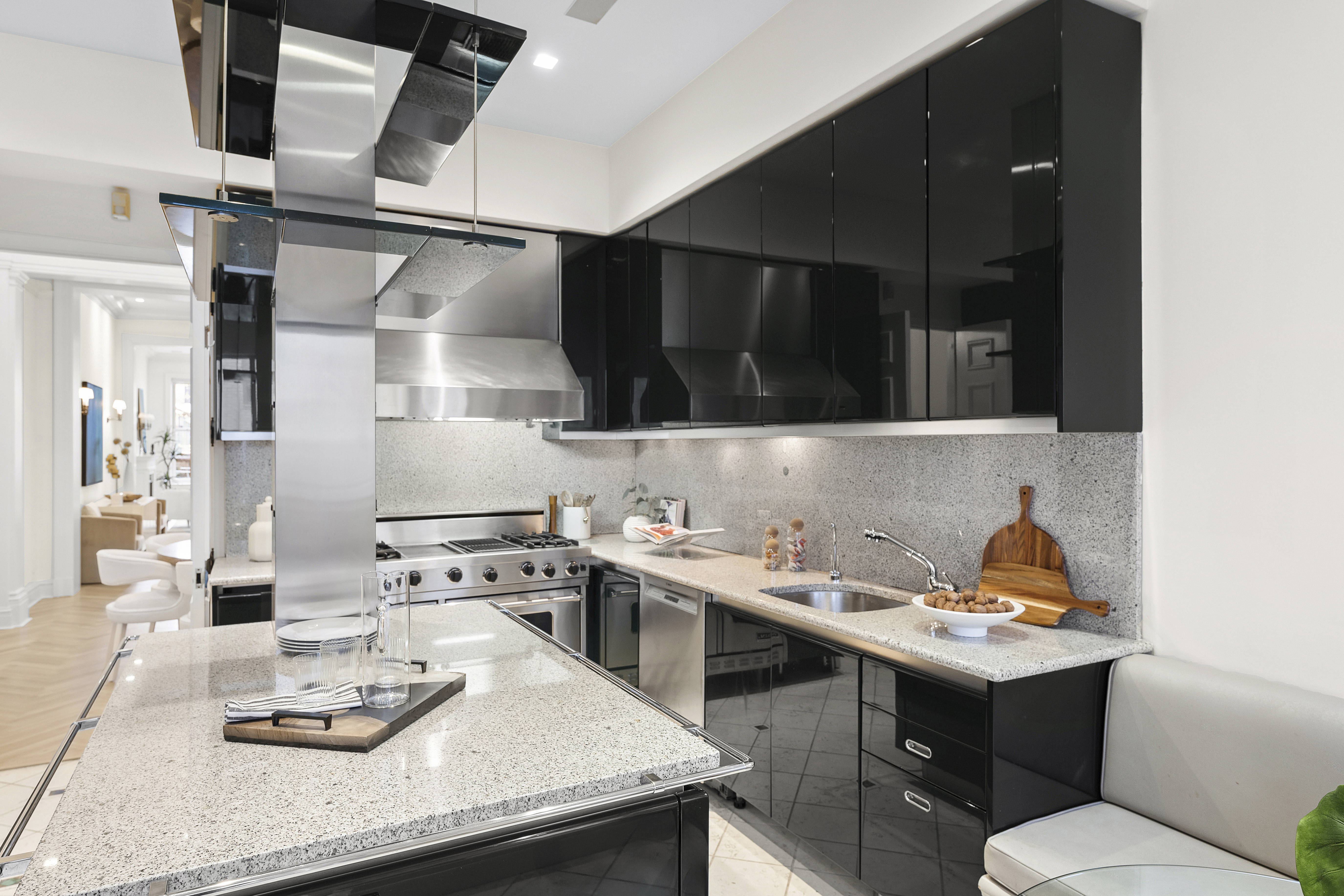 50 East 73rd Street Manhattan, NY 10021 - Photo 18 of 32 a kitchen with a sink a stove and chairs
