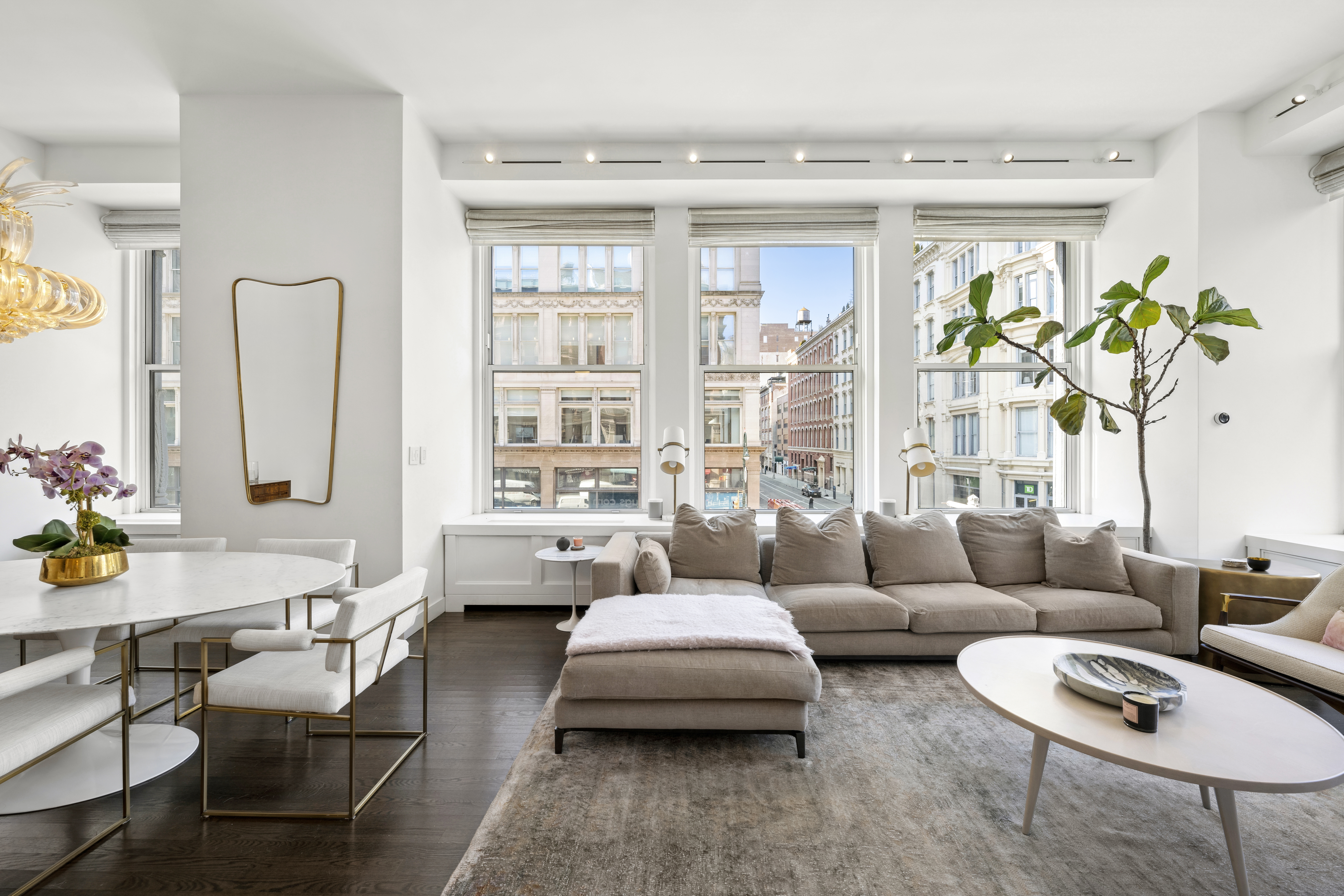 60 West 20th Street, Unit 2F Manhattan, NY 10011 - Photo 3 of 21 a living room with furniture and a large window