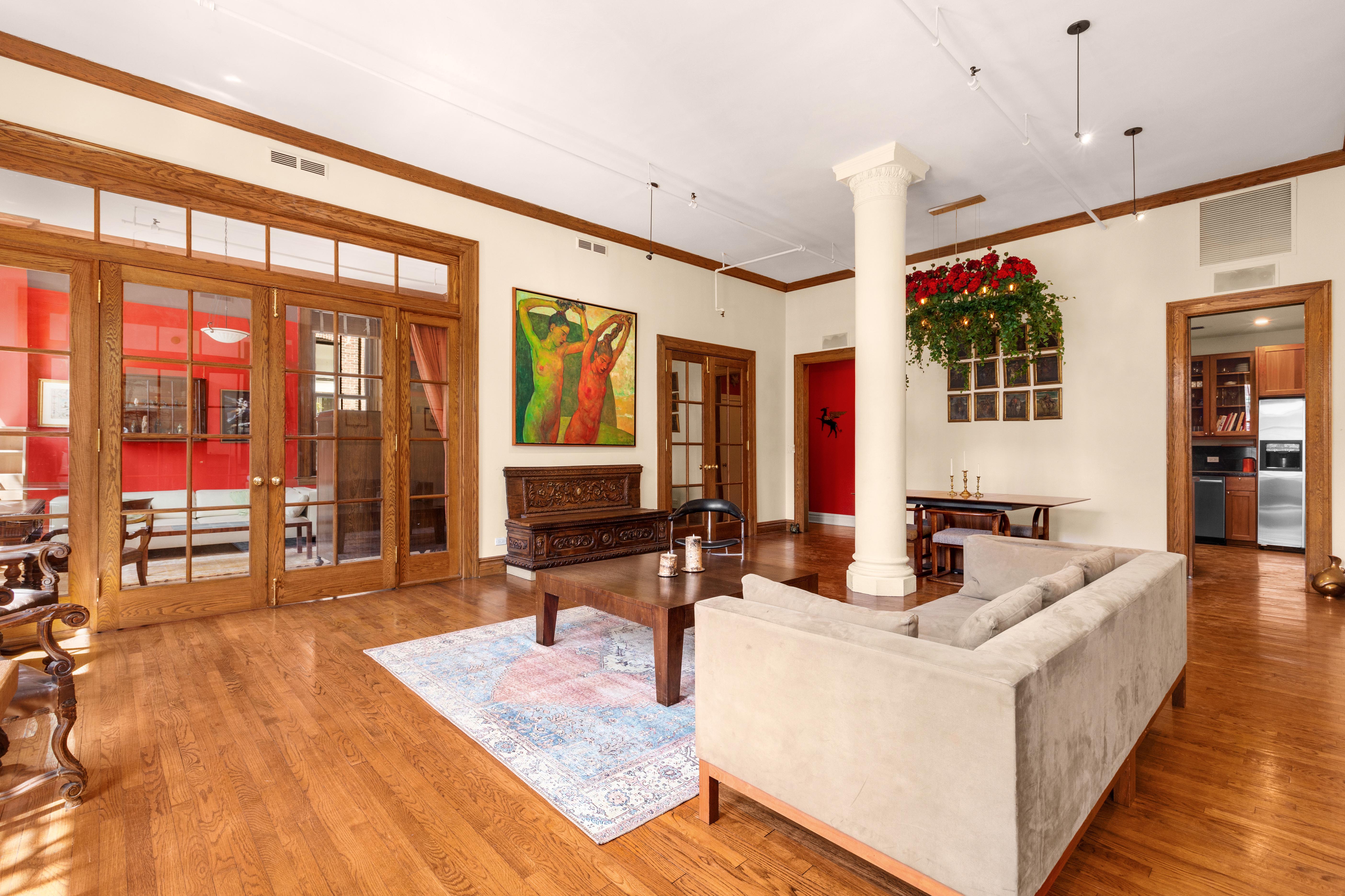 30 East 21st Street, Unit 6B Manhattan, NY 10010 - Photo 5 of 16 a living room with furniture and large windows