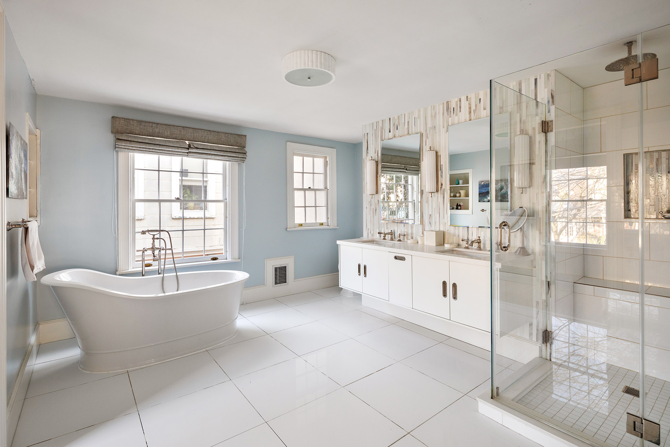 162 Argyle Road Brooklyn, NY 11218 - Photo 12 of 25 a spacious bathroom with a tub sink shower and mirror
