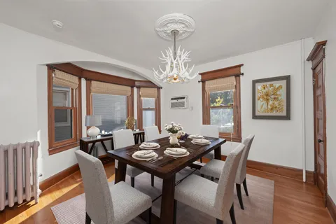 a bathroom with a granite countertop sink a mirror and a shower