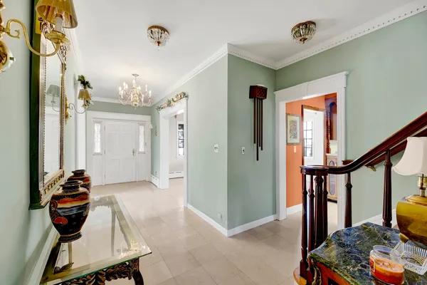 a living room with furniture and a piano