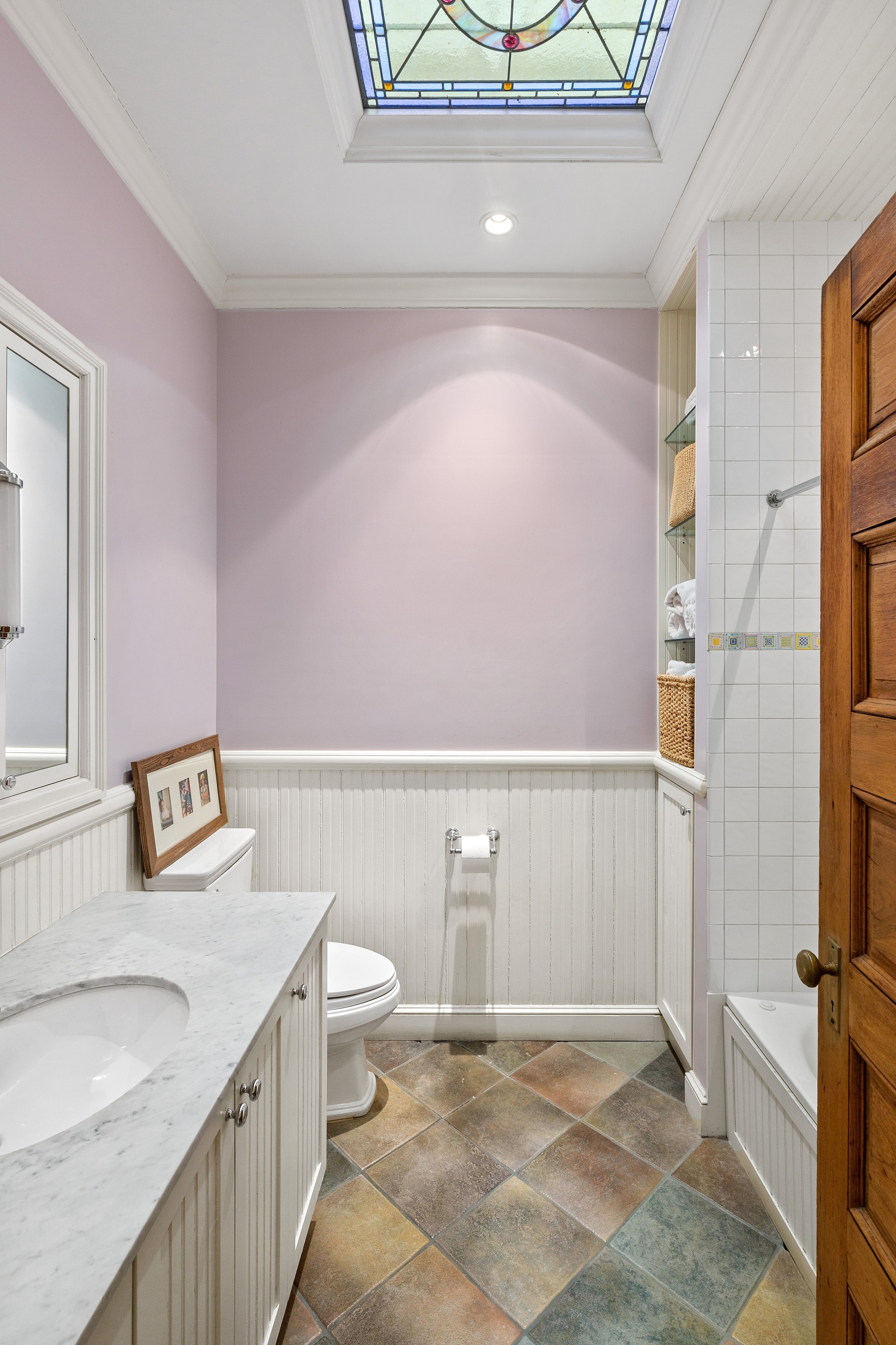333 West 71st Street Manhattan, NY 10023 - Photo 19 of 29 a bathroom with a sink a toilet and shower