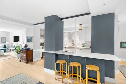 a view of living room with furniture and flat screen tv