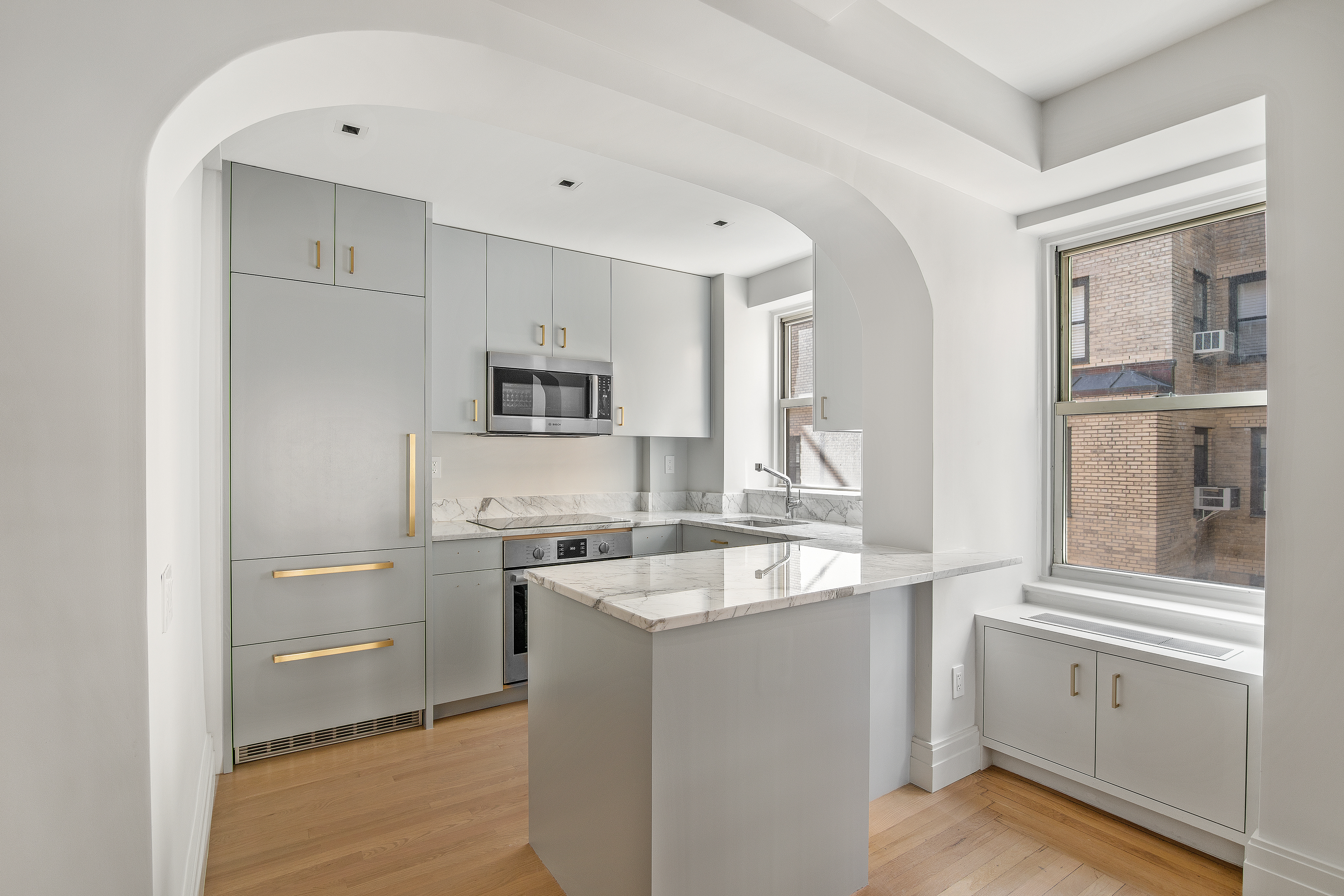 434 East 52nd Street, Unit 10E Manhattan, NY 10022 - Photo 4 of 13 a kitchen with a sink stove and refrigerator