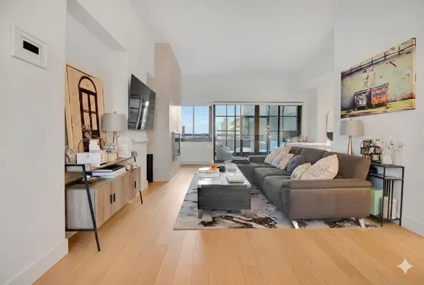 a living room with furniture and a large window