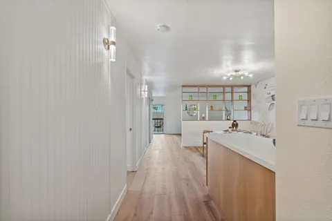 a kitchen with stainless steel appliances a sink and cabinets