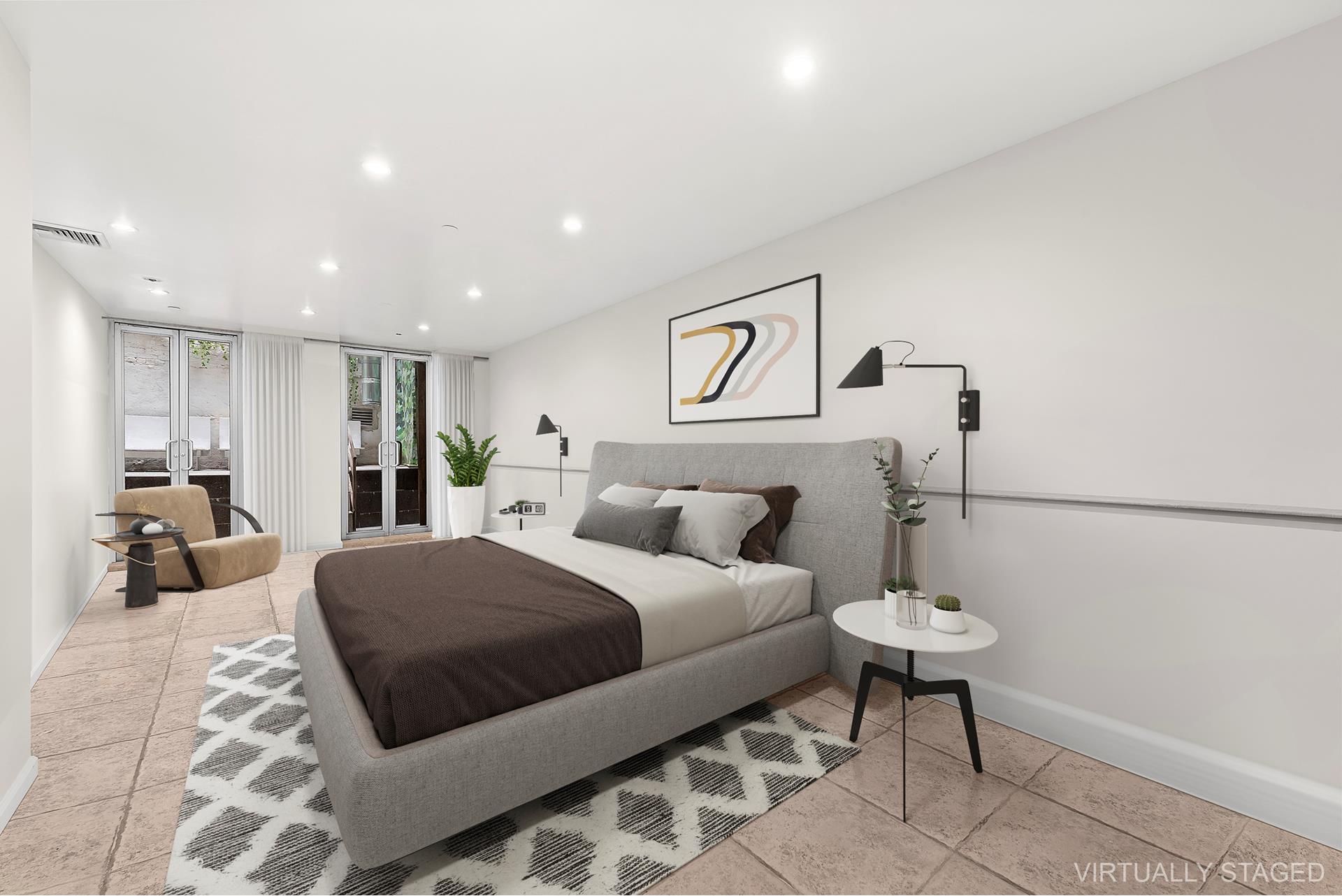 53 Murray Street, Unit 1 Manhattan, NY 10007 - Photo 13 of 15 a bedroom with a large bed and a chandelier