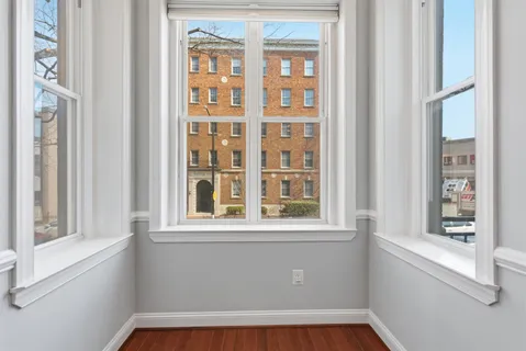 a view of an empty room with a window