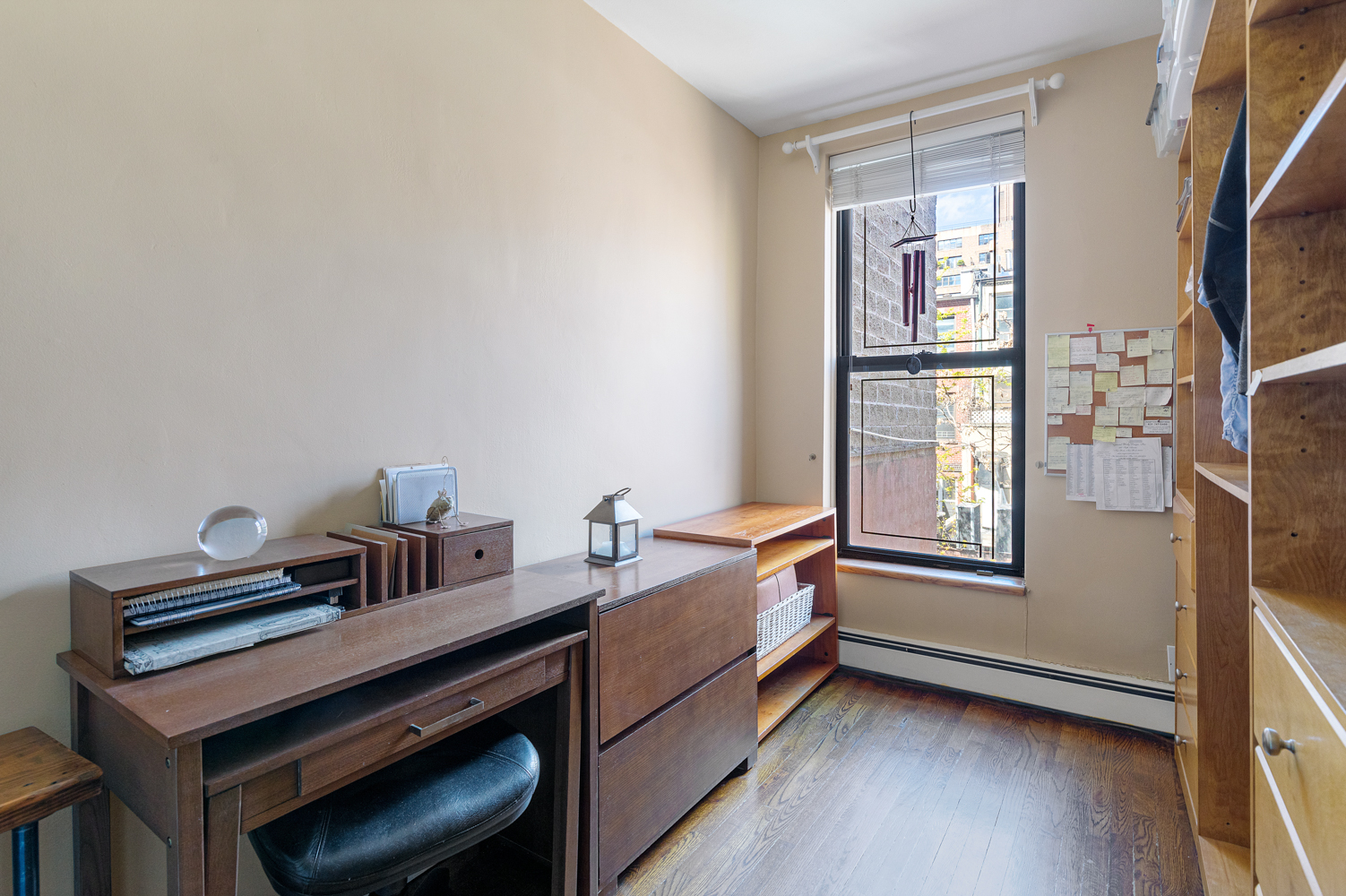 161 West 71st Street, Unit 4 Manhattan, NY 10023 - Photo 7 of 15 a room with a bed and a window