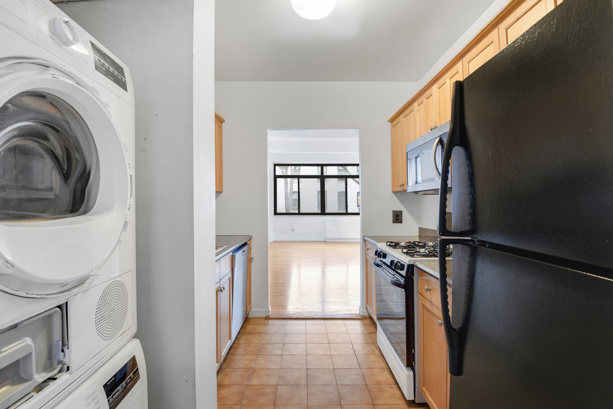 492 Henry Street, Unit 2A Brooklyn, NY 11231 - Photo 6 of 13 a kitchen with a refrigerator and a stove top oven