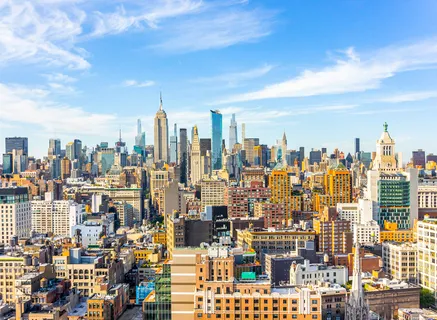 a view of a city with tall buildings in the background