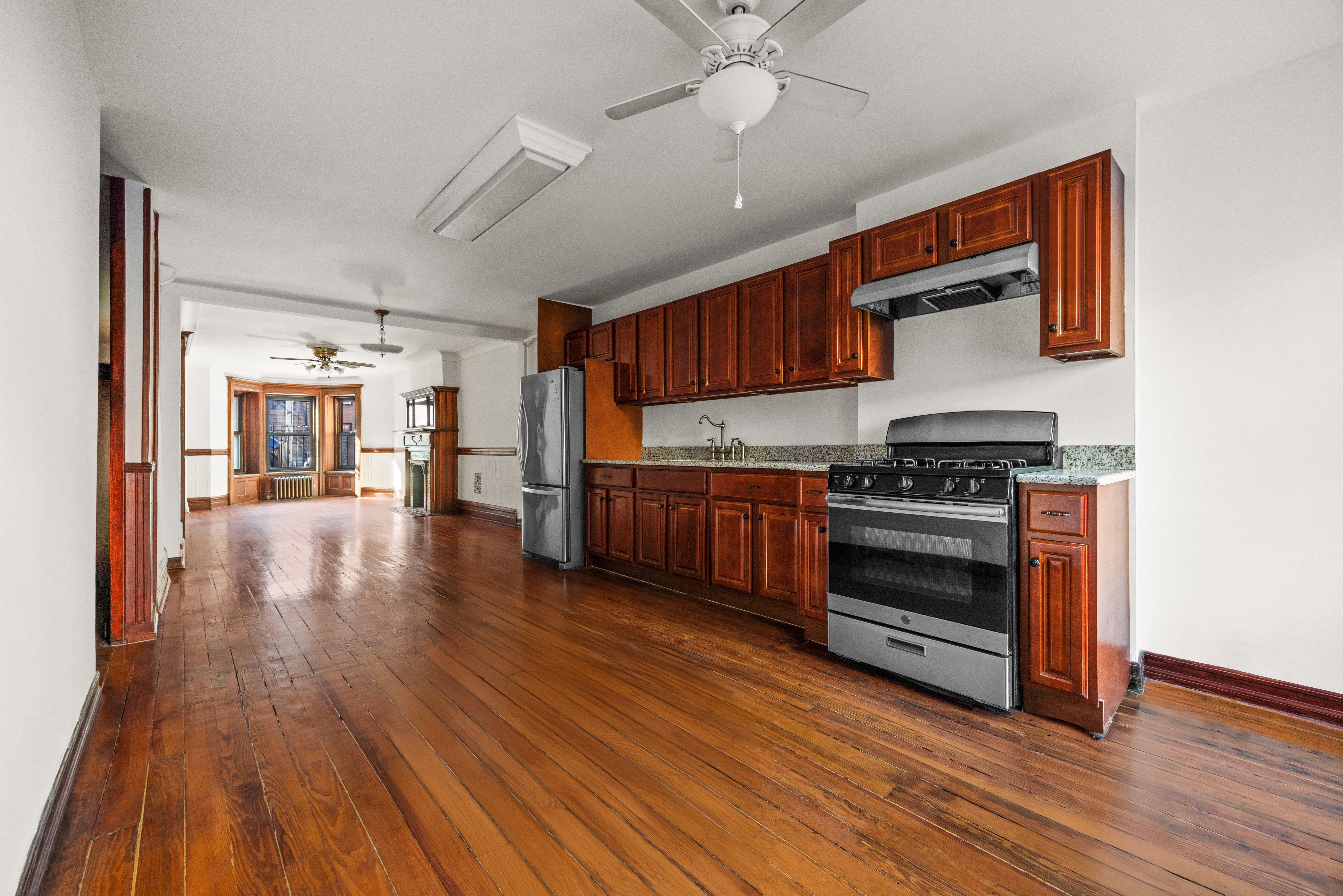 415 5th Street, Unit 1 Brooklyn, NY 11215 - Photo 7 of 14 a kitchen with stainless steel appliances granite countertop a stove and a wooden floors
