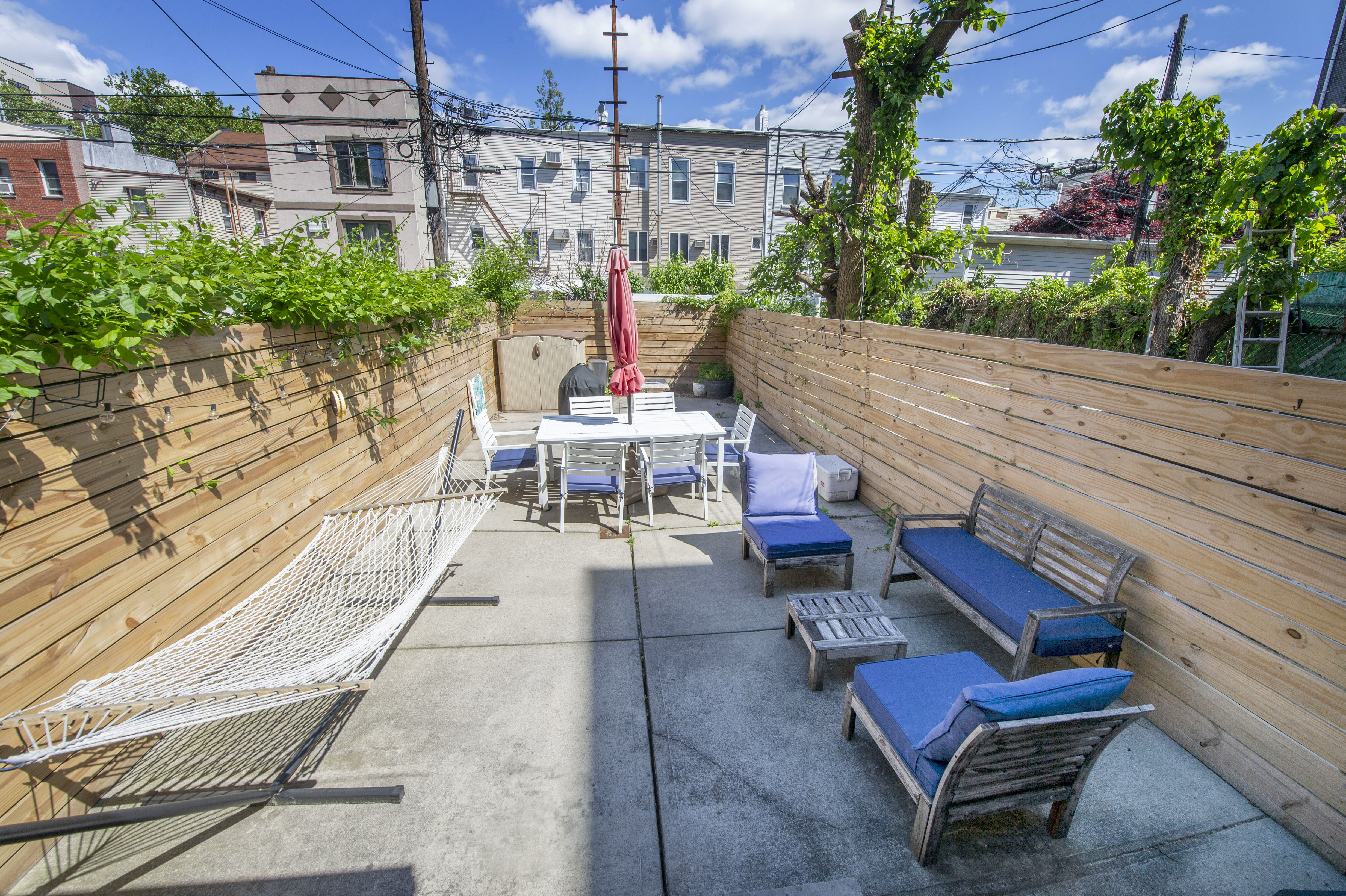 185 A Powers Street, Unit 1 Brooklyn, NY 11211 - Photo 6 of 13 an outdoor sitting area with couch and plants